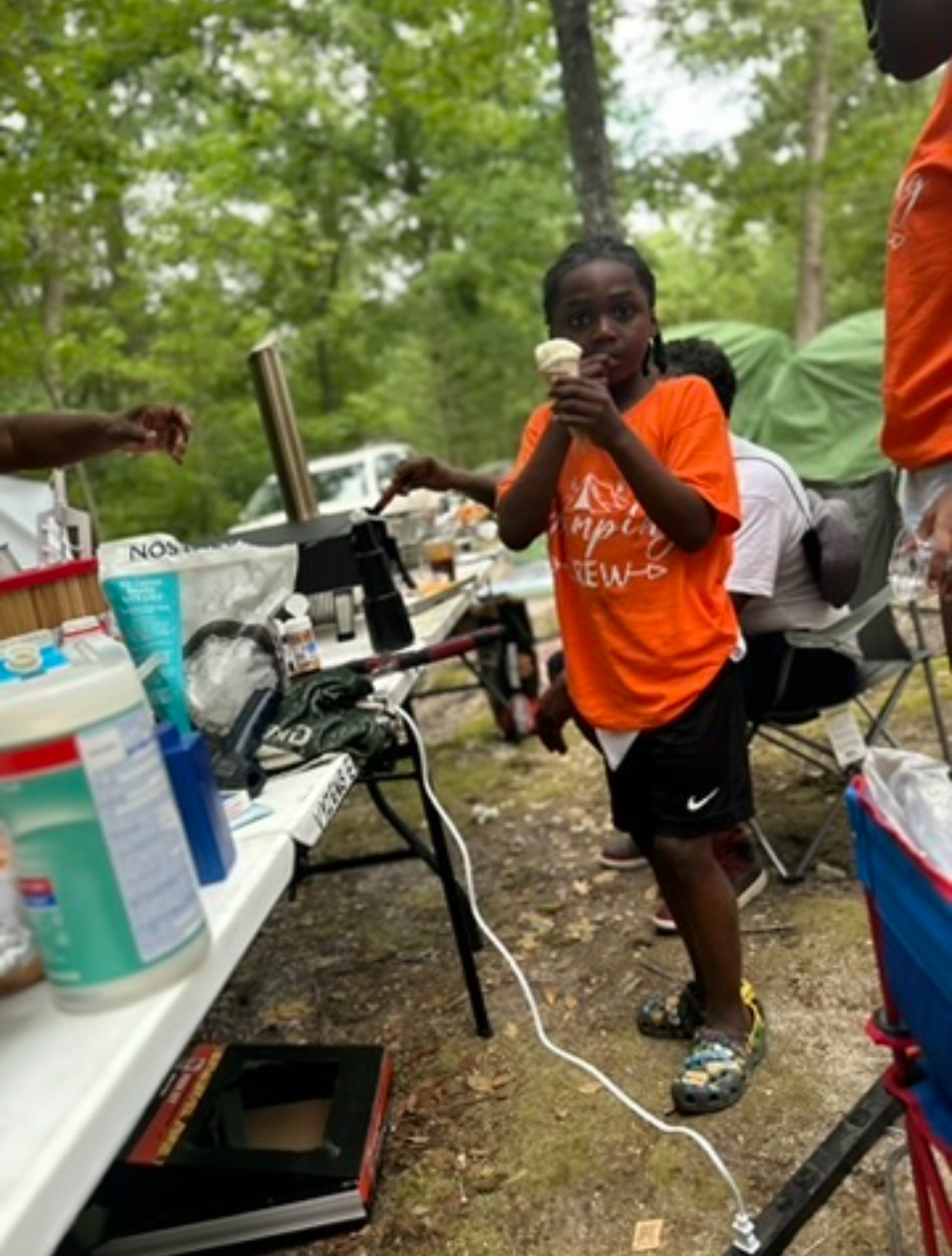 Child eating ice cream at the glamping site
